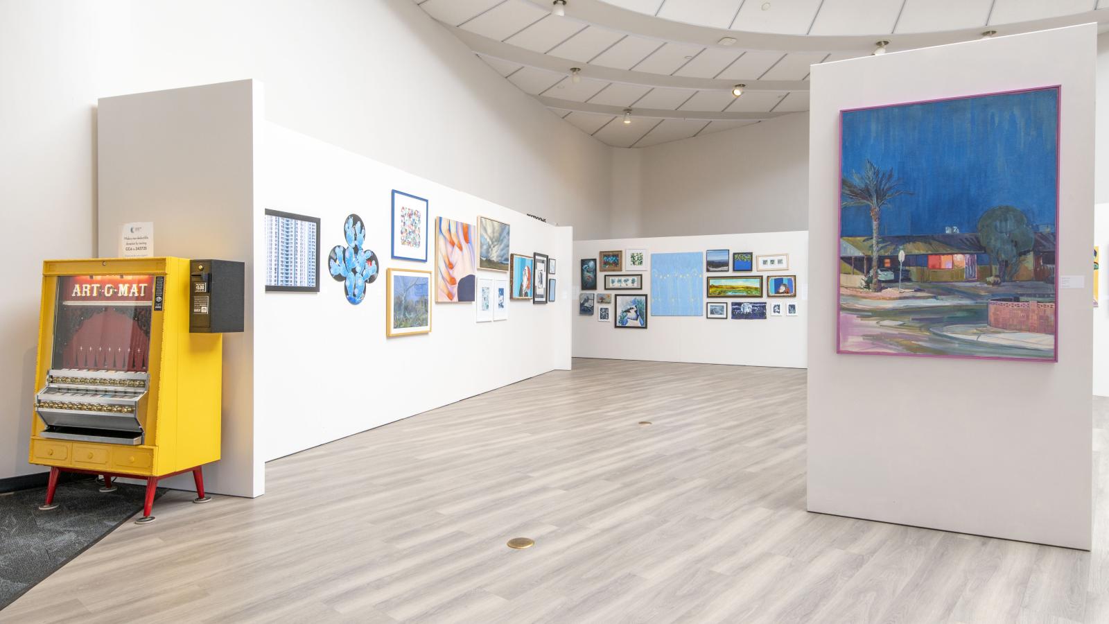the gallery is empty of people, but full of art