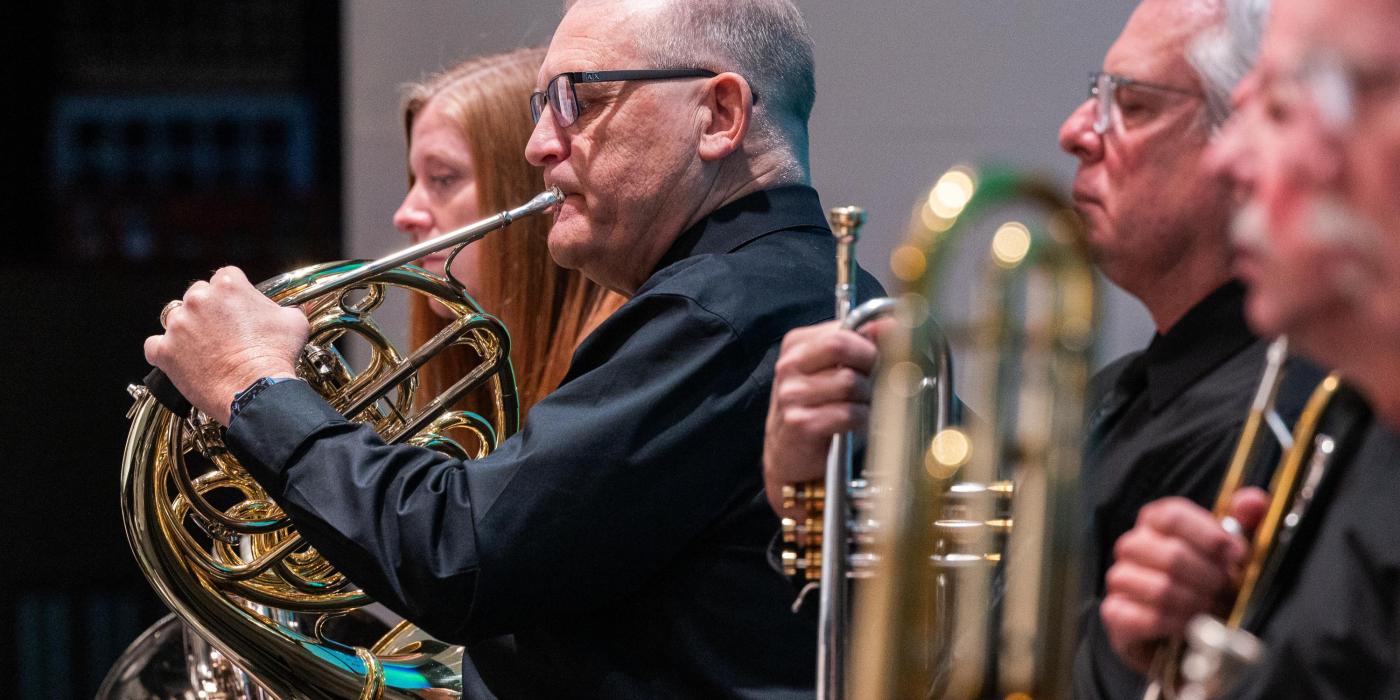 Man playing horn instrument