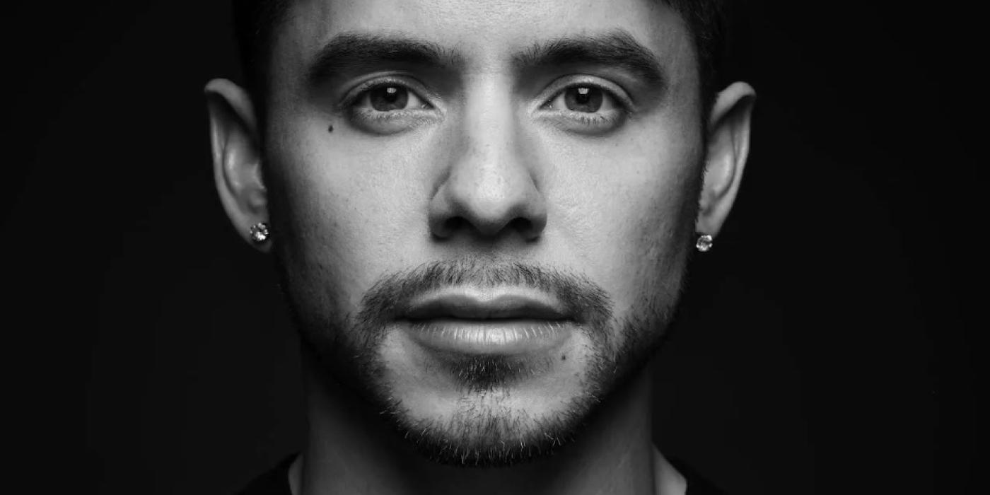 Black and white photo of a male. 