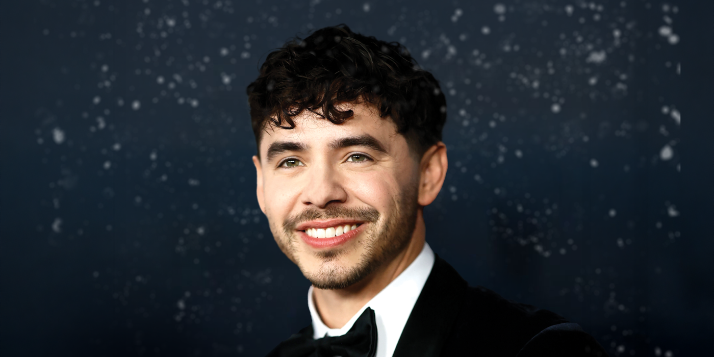 David Archuleta in a black tux, smiling against a snowy backdrop