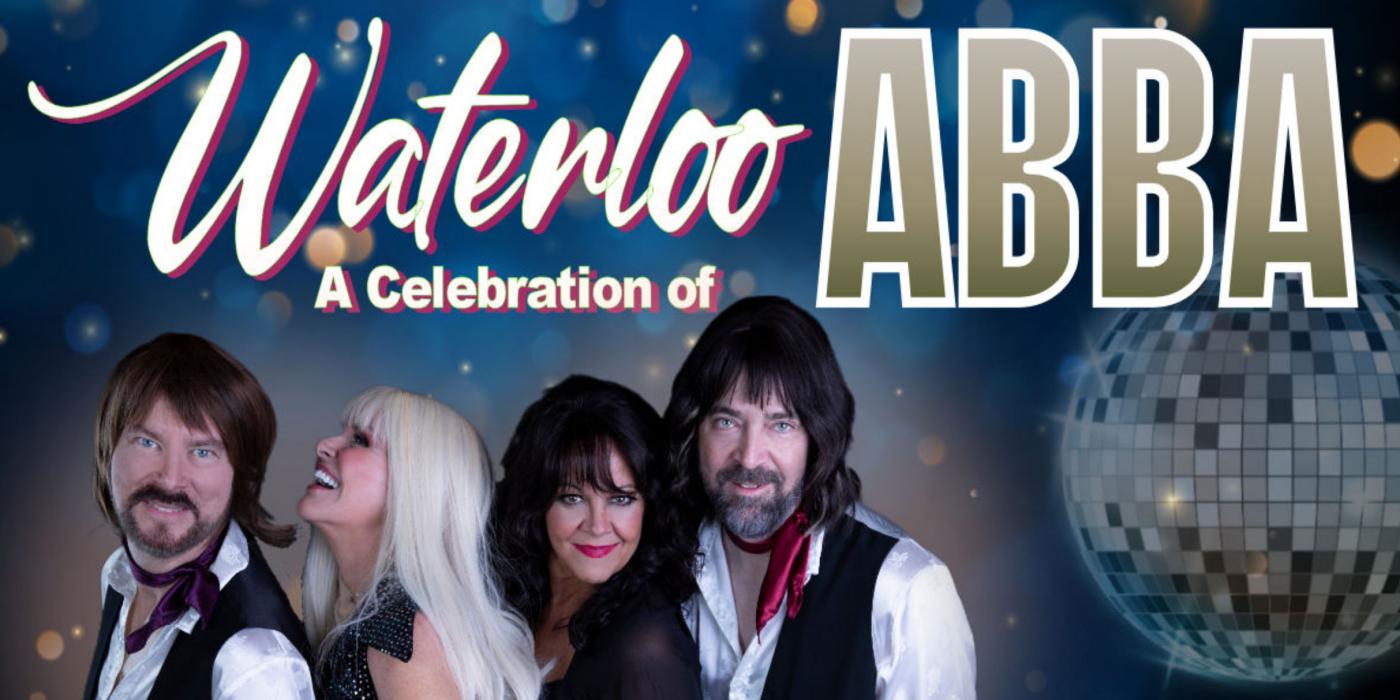 4 performers dressed in disco attire 