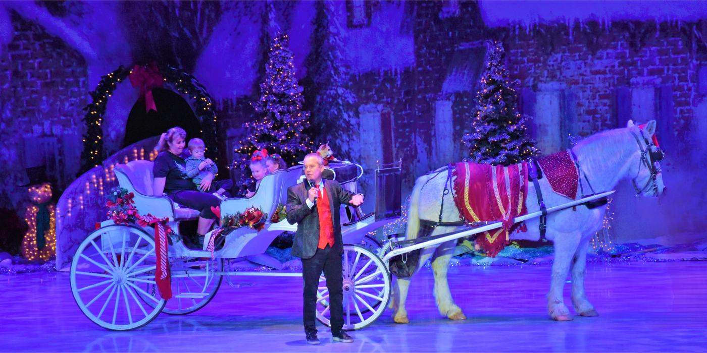horse and carriage on stage with the host