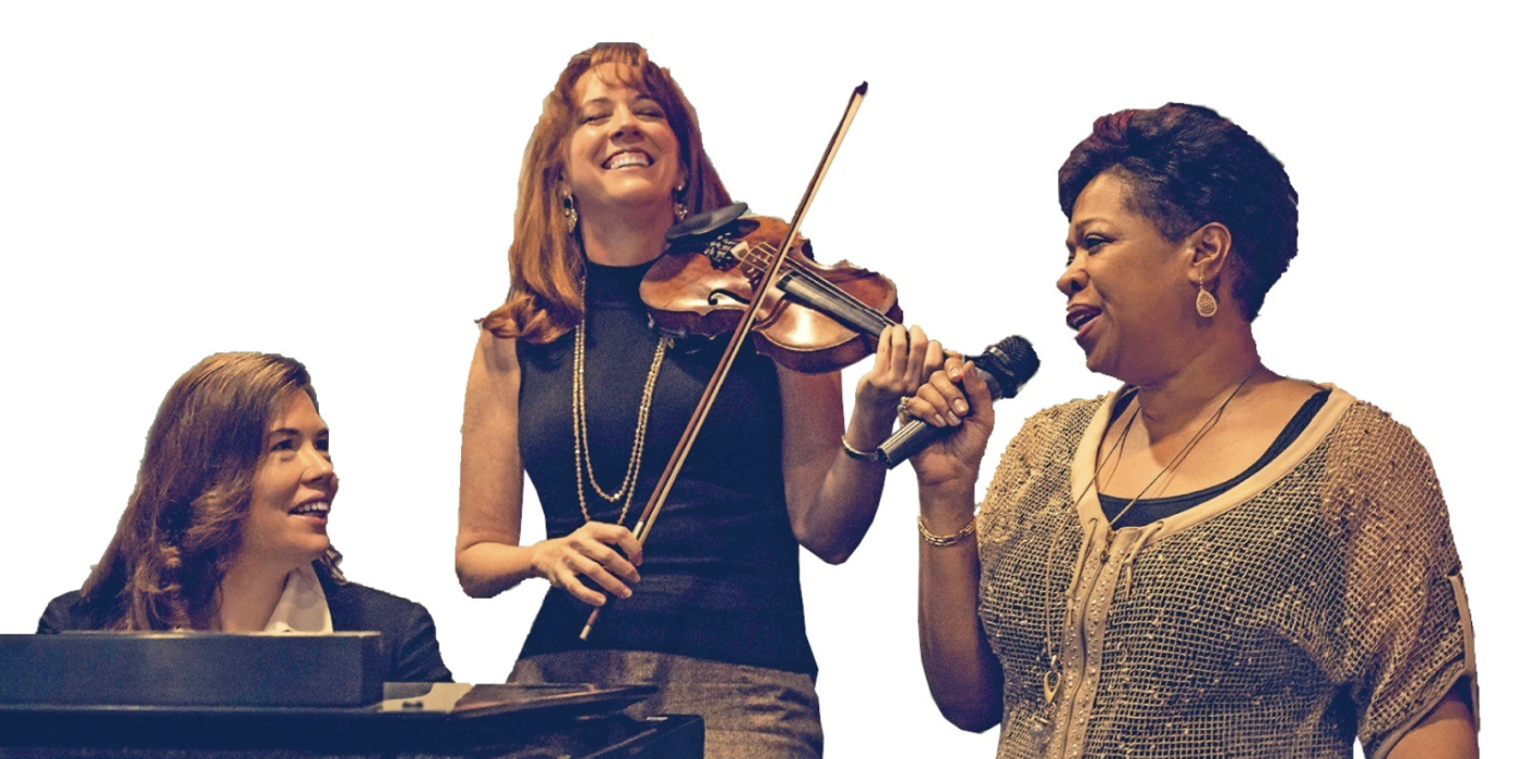 There are three women, smiling - one plays the violin, one plays the piano and the other is singing. 