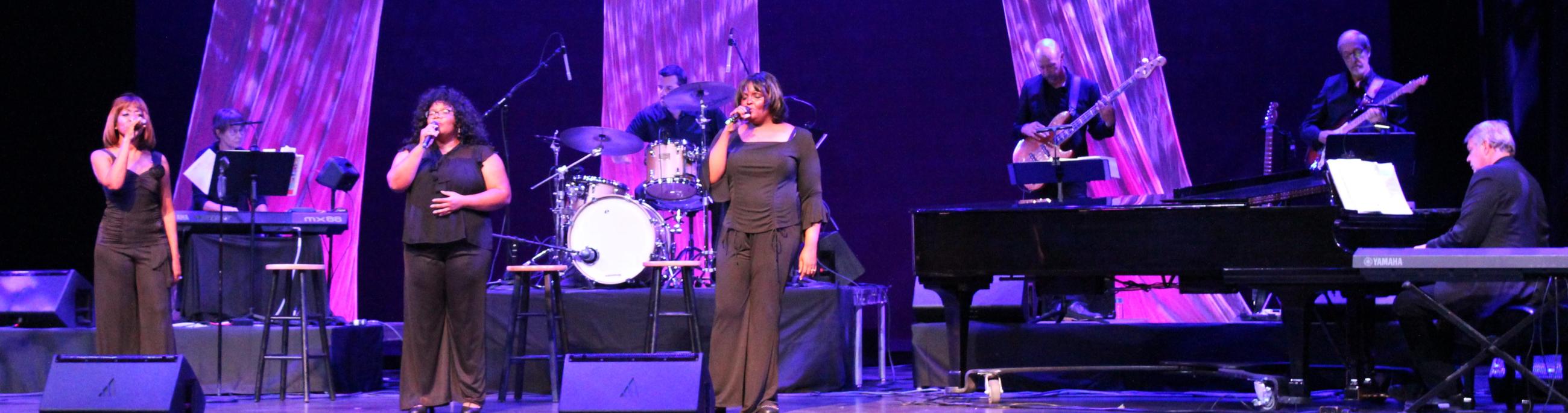 The Legendary Ladies of Soul trio sings on the CCA mainstage in front of the band in black gowns