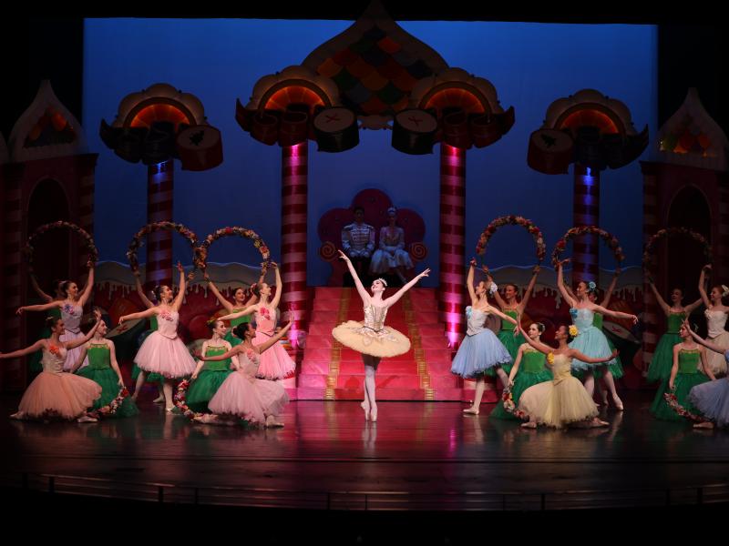 ballerinas dance in various colored tutus