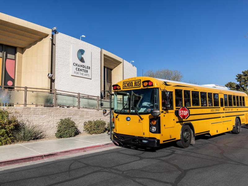 School bus parked outside of CCA box office
