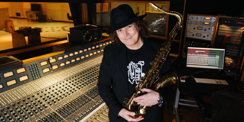 boney james stands in the recording studio with his saxophone