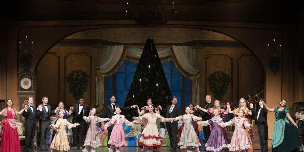 the cast of the nutcracker dance together on stage