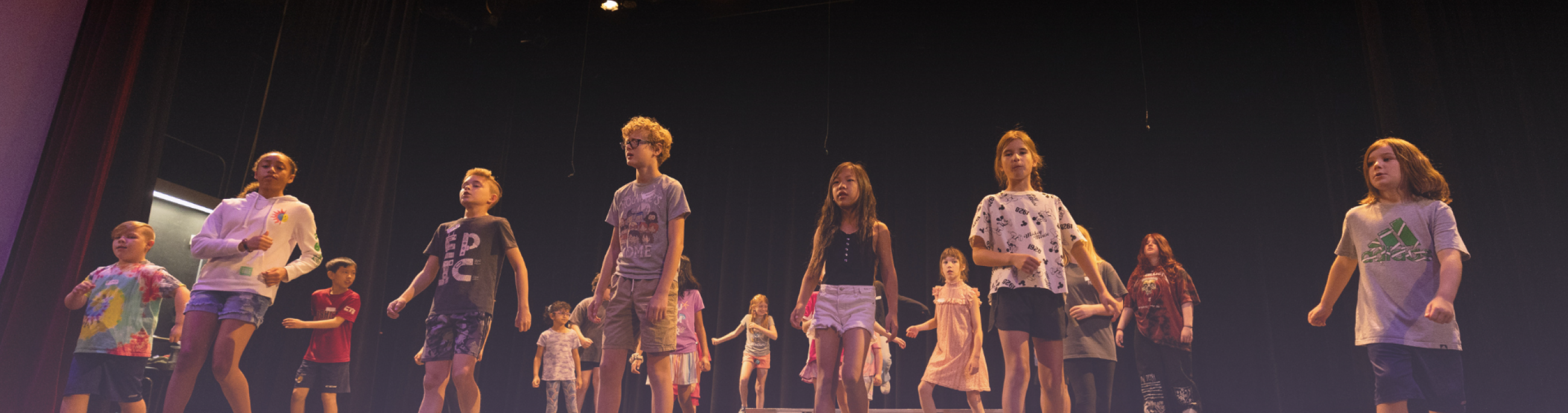 Kids on stage during rehearsal.