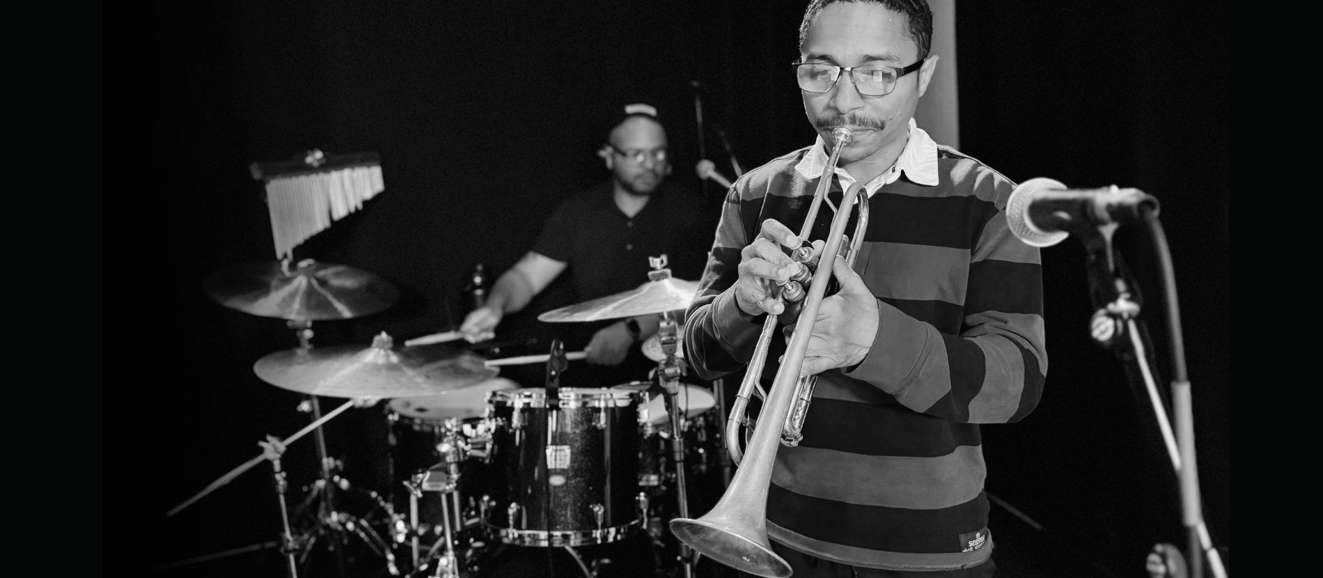 Yellowroot cast playing trumpet and drums