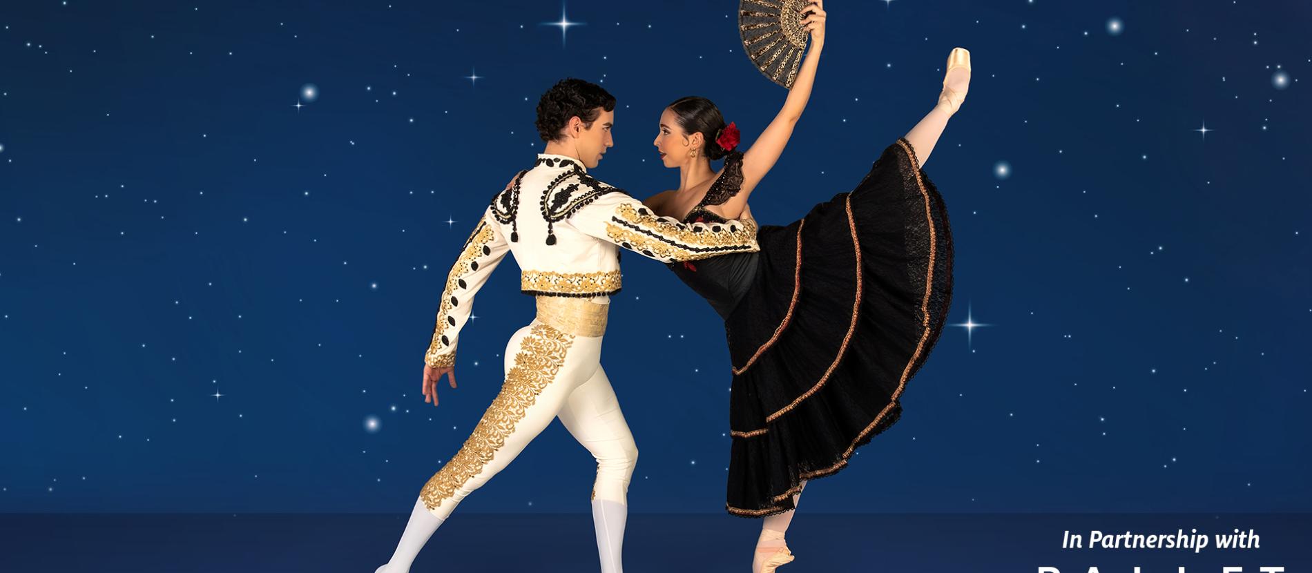 a man and woman dance against a night sky