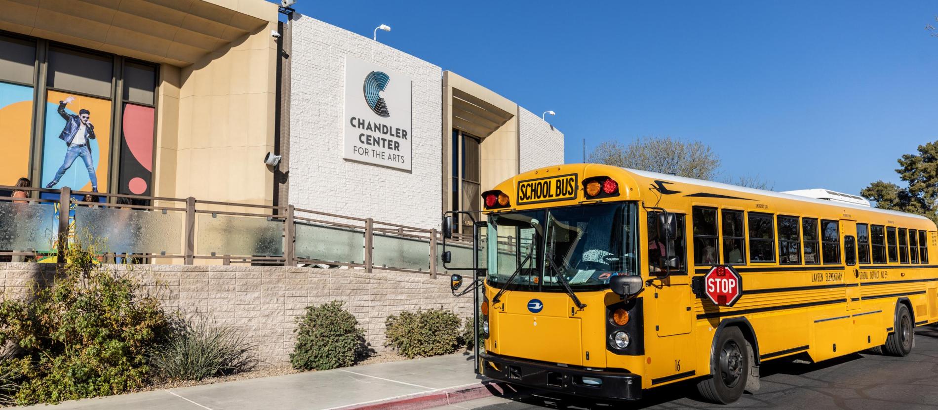 School bus parked outside of CCA box office