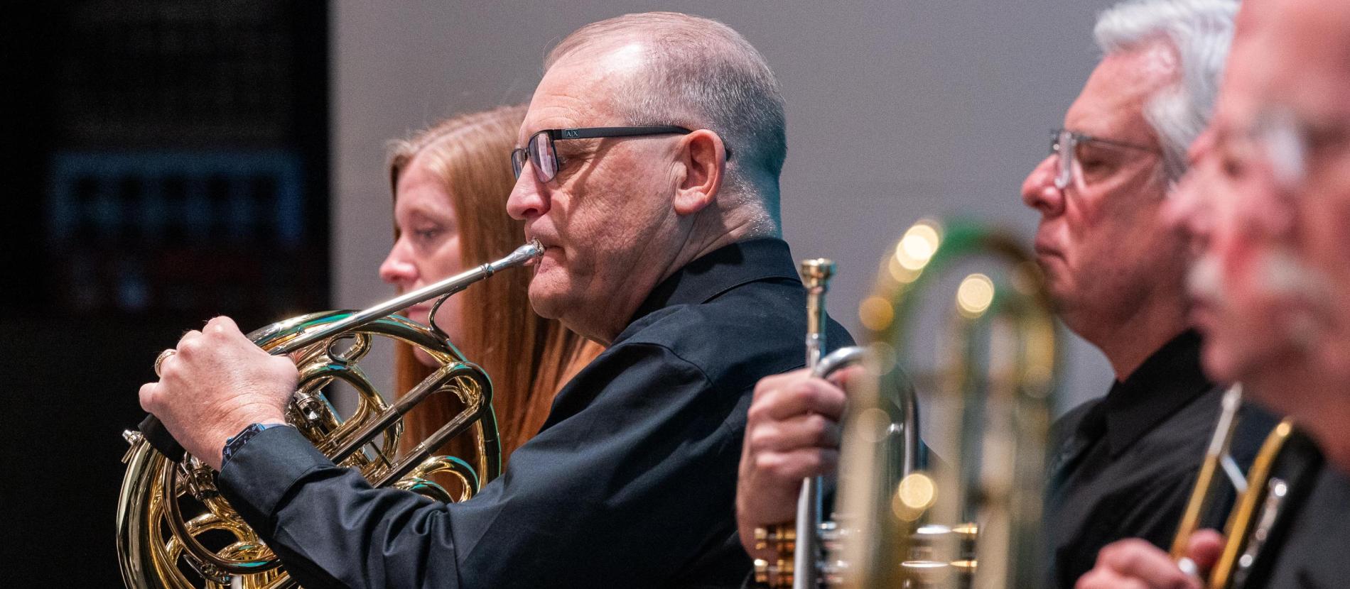 Man playing horn instrument