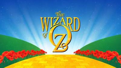 Gold letters proclaim Wizard of OZ with a yellow brick road below it