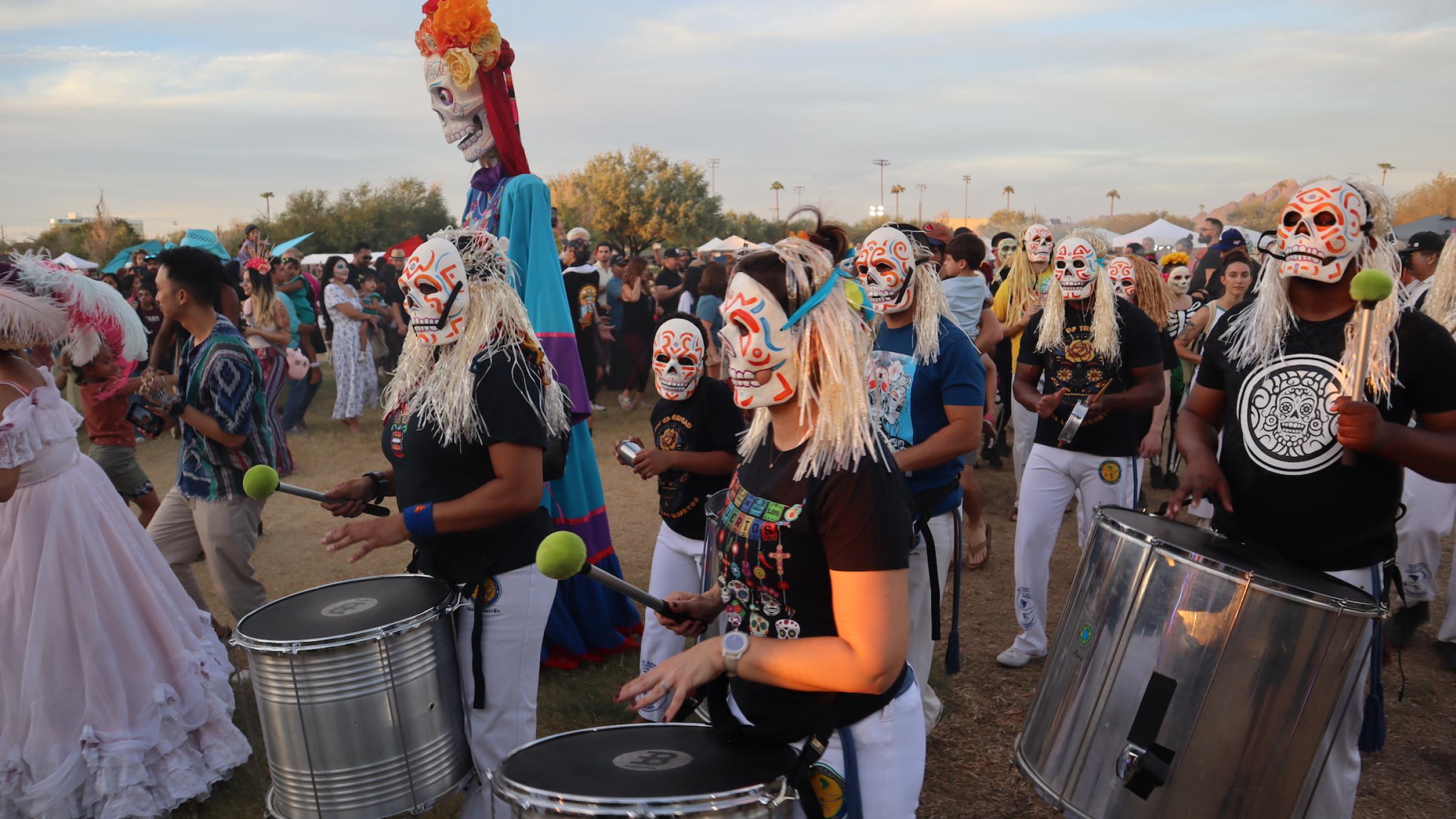 Axe Capoeira procession with drummers and giant puppets